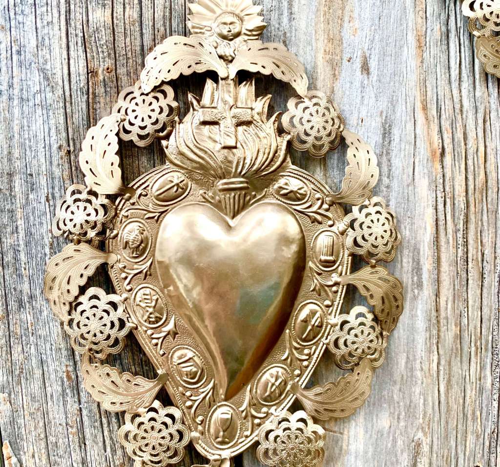Antique ex-voto devotional objects displayed for sale at a market in Umbria or Tuscany