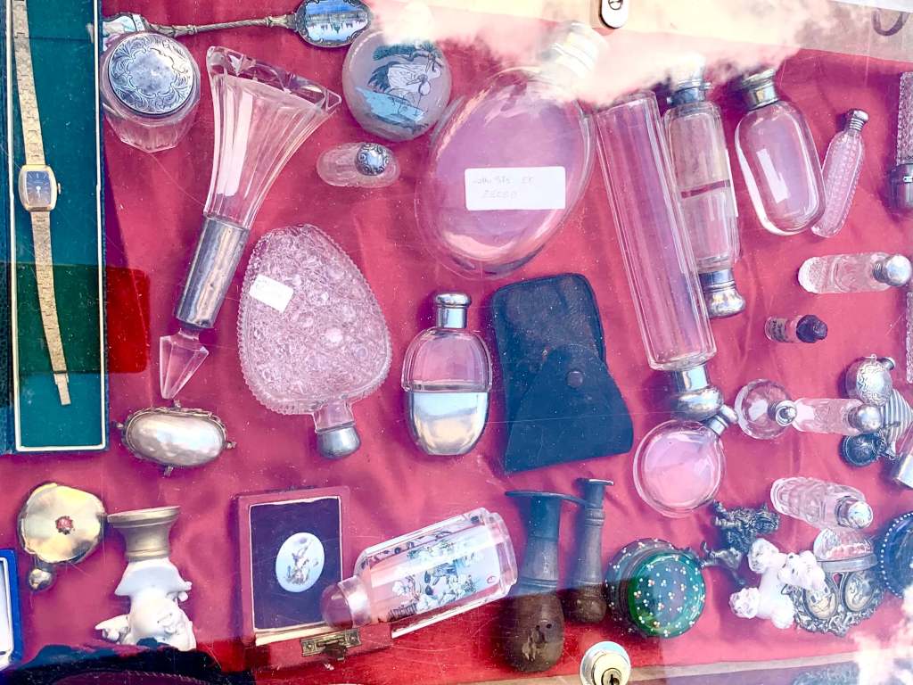 Antique treasures and vintage collectables displayed at a market in Umbria or Tuscany